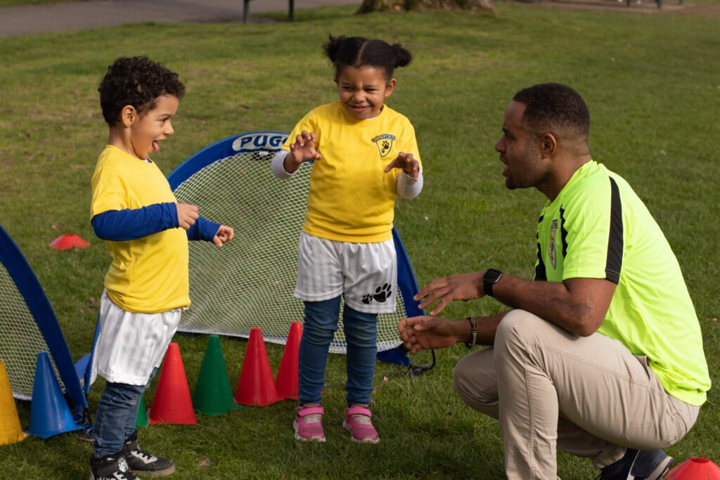 children playing with coach